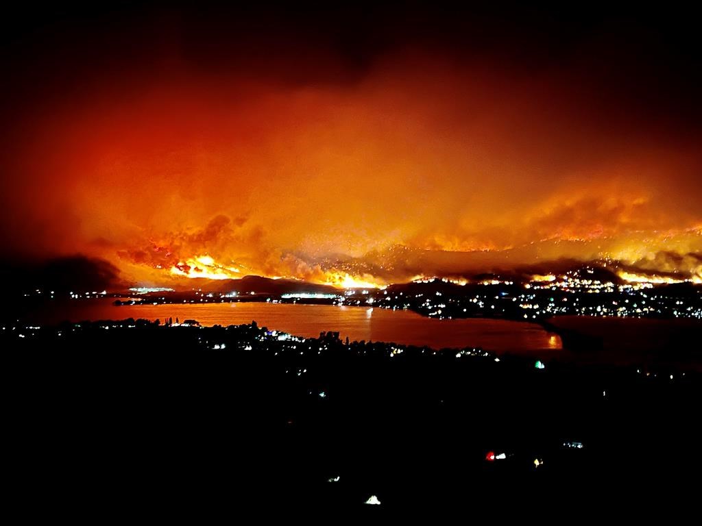 A wildfire burns close to Osoyoos and lights up the sky.