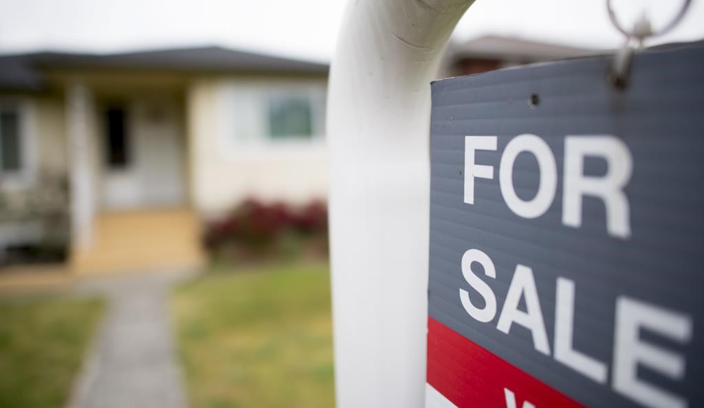 A real estate sign is pictured in Vancouver on Tuesday, June 12, 2018