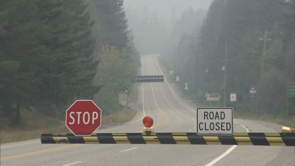 Highway 1 is seen, blocked by cones and road closed signs