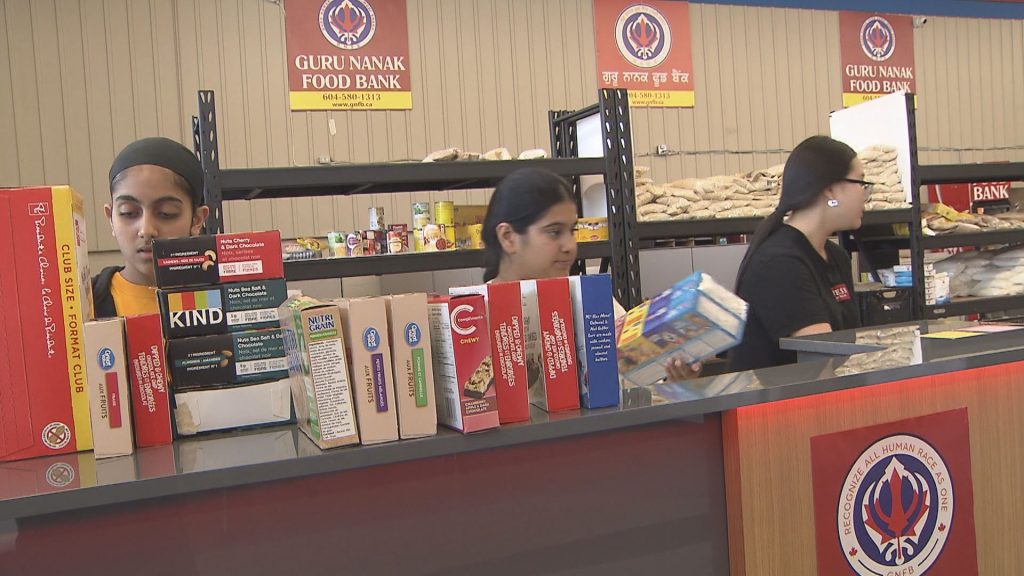 A team at Guru Nanak Food Bank preparing supplies to be sent to wildfire evacuees in B.C.'s Interior.