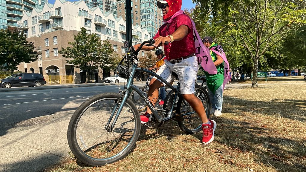 Attendees of a rally for temporary foreign workers voiced their demands to the federal and provincial governments Sunday, dressed in colourful costumes representing labour farm jobs.
