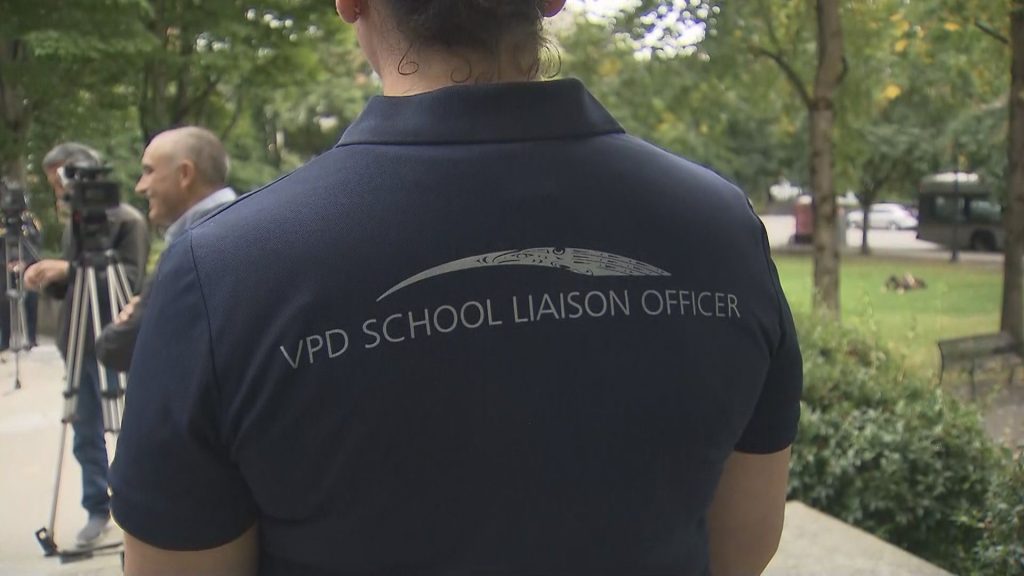 The back of a VPD School Liaison Officer is seen in uniform