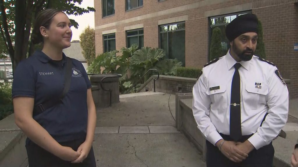 A VPD School Liaison Officer is seen in uniform alongside a VPD officer