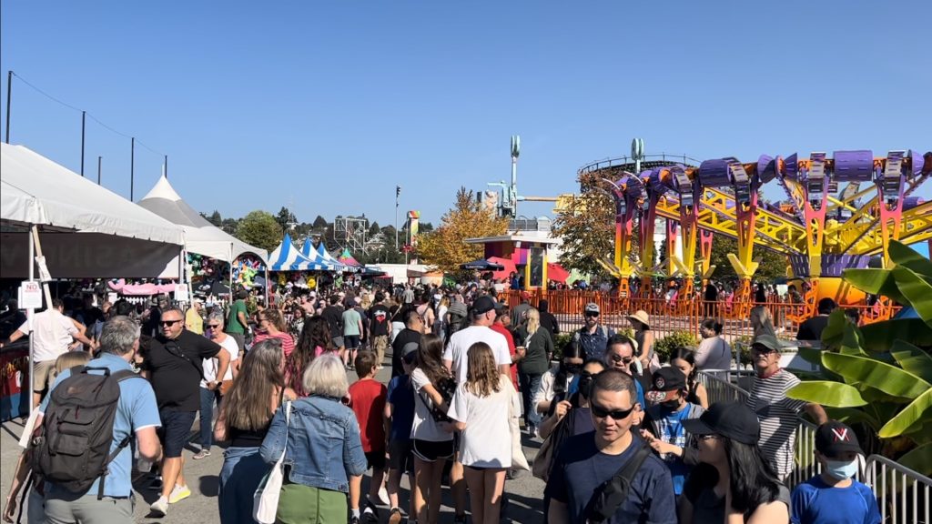 Fair-goers at the Pacific National Exhibition / Playland