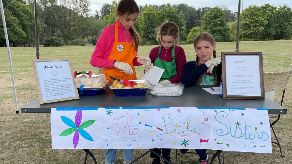 Axelle, Julia and Anaïs, founders of ' The Baker Sisters,' sold their madelaines on Jericho Beach on Sunday