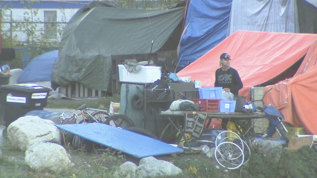 Tents and other structures can be seen on the shoreline of CRAB Park