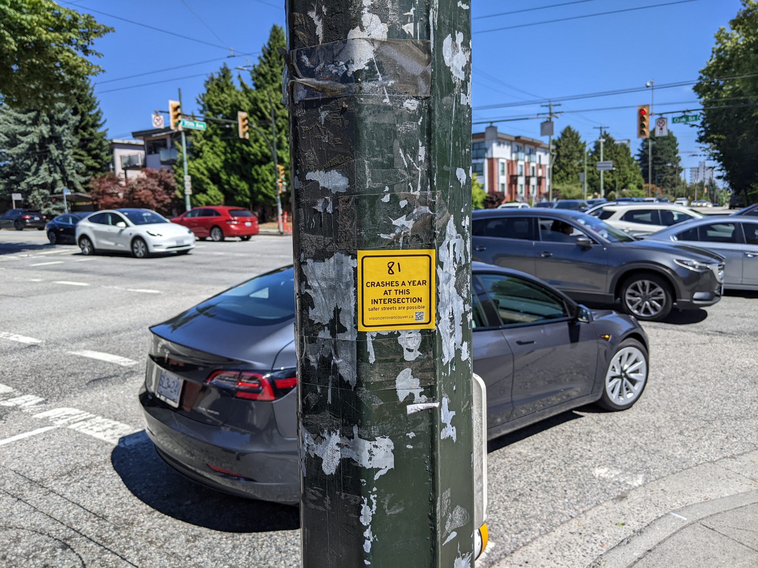 A sticker posted at the intersection of Oak Street and 70 Avenue in Vancouver. 