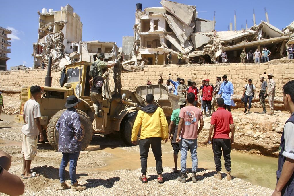 People look for survivors in Derna, Libya, Wednesday, Sept.13, 2023. 