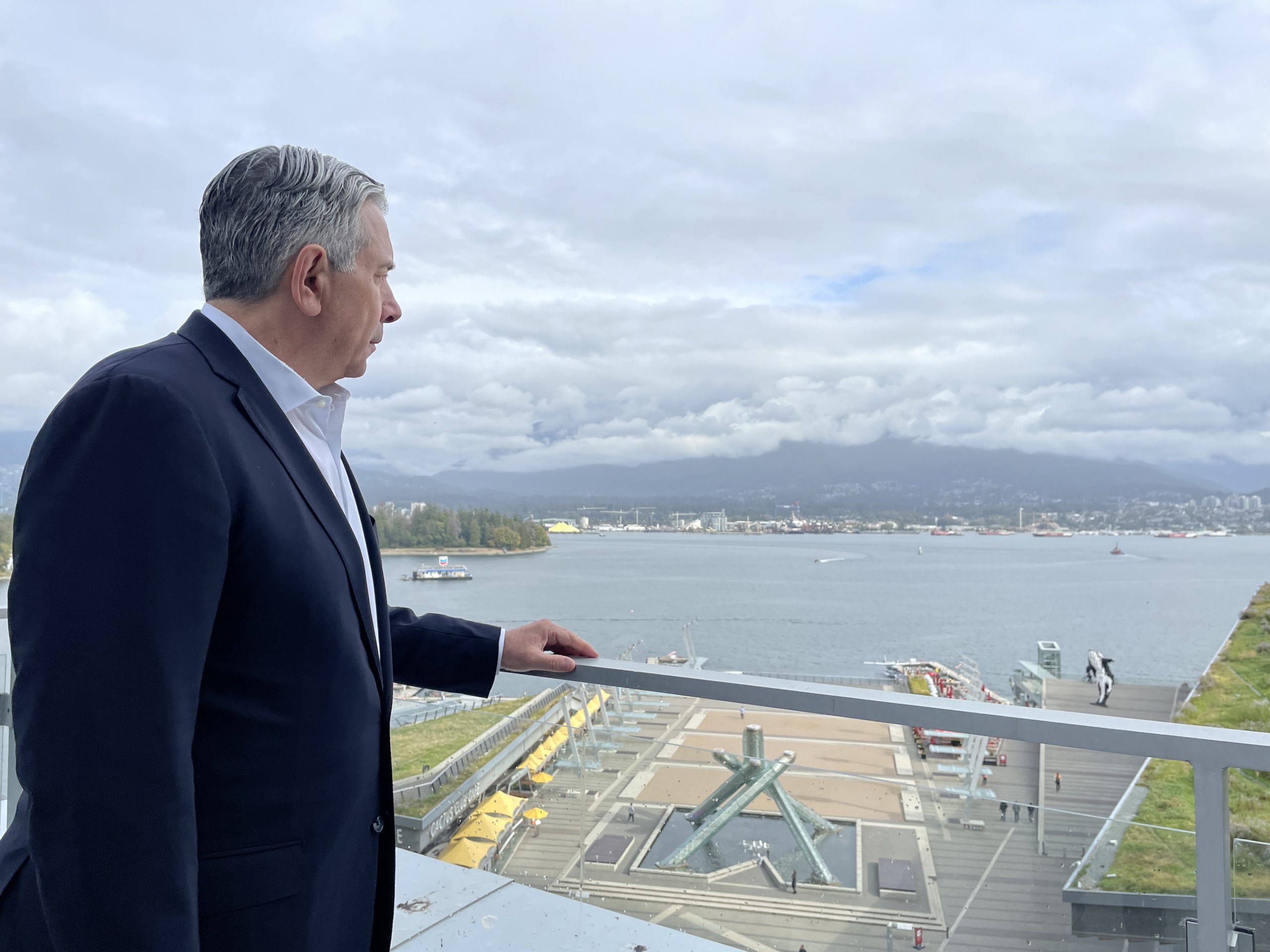 Rogers CEO Tony Staffieri looks toward the North Shore from Vancouver across the Burrard Inlet. He announced on Thursday, Sept. 21, 2023, new technology to help detect, hopefully prevent, and manage wildfires. 