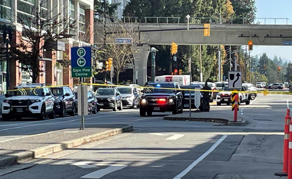 Coquitlam RCMP cruisers block off a street near the area of Pinetree Way and Glen Drive after a major police incident and reported shooting on Friday, Sept. 22, 2023