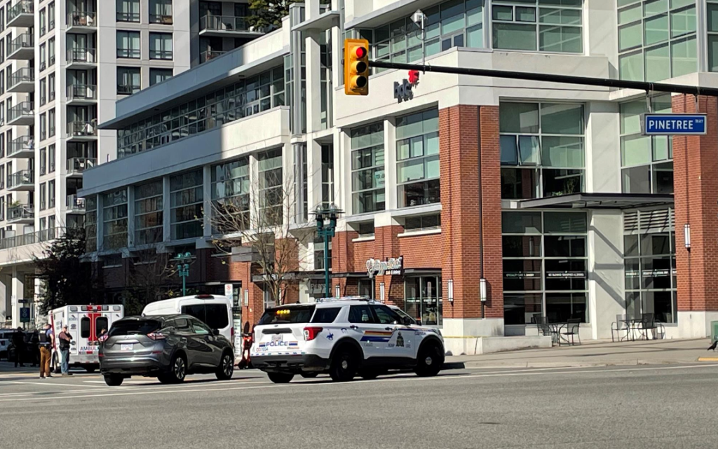 Coquitlam RCMP cruisers block off a street near the area of Pinetree Way and Glen Drive after a major police incident and reported shooting on Friday, Sept. 22, 2023.