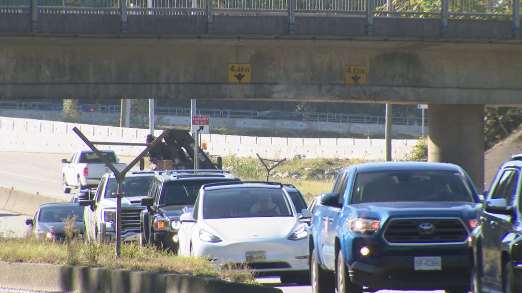 Truck driver involved in North Van overpass crash fired, company says