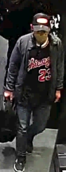 One of two suspects wanted in connection with a reported theft and assault at Metrotown Mall in Burnaby on Sept. 17. This person is wearing dark baseball cap with a red logo on it, a grey jacket, dark shirt with "Chicago" and "23" on the front, blue jeans, and black shoes with white soles. They were carrying a black backpack at the time of the incident. 