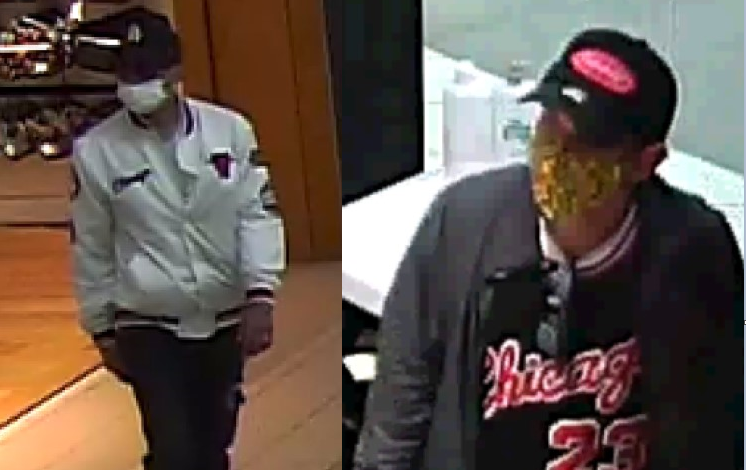 Two suspects wanted in connection with a reported theft and assault at Metrotown Mall in Burnaby on Sept. 17. One is wearing a dark-coloured baseball cap with a white LA Dodgers logo on the front, a white medical mask, and glasses. The other is wearing a dark baseball cap with a red logo on it, a grey jacket, dark shirt with "Chicago" and "23" on the front, blue jeans, and black shoes with white soles. They were carrying a black backpack at the time of the incident.