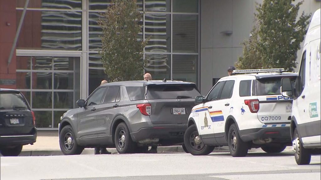 Coquitlam RCMP cruisers and officers seen outside Centennial Secondary School