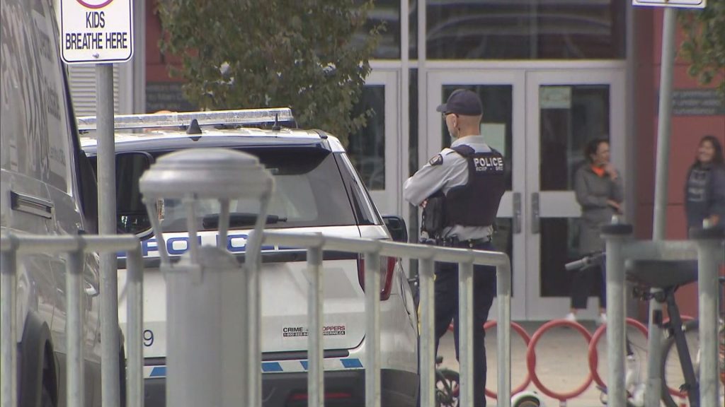 Coquitlam RCMP cruisers and officers seen outside Centennial Secondary School