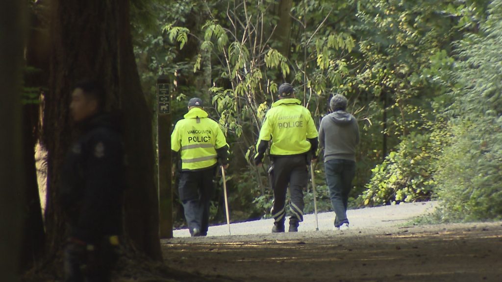 Vancouver Police Officers search for a missing woman near Pacific Spirit Park near the University of British Columbia