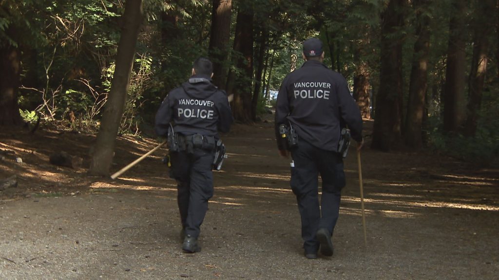 Vancouver Police Officers search for a missing woman near Pacific Spirit Park near the University of British Columbia