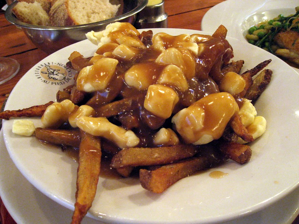 French fries, gravy, and cheese curds on a plate