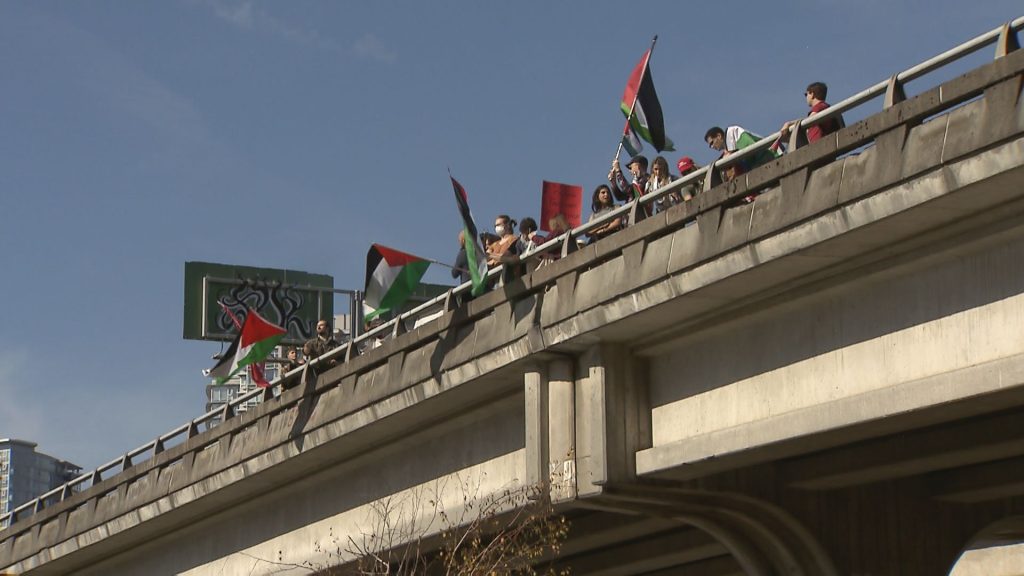 People gather to demonstrate in Vancouver after attacks on Israel by Hamas began Saturday