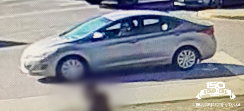 A silver sedan that picked up a girl outside of College Heights Secondary School in Prince George.