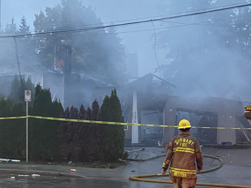 A series of four homes in Burnaby have been badly damaged after an early morning fire tore through the structures Wednesday. (Mike Lloyd / CityNews Image)