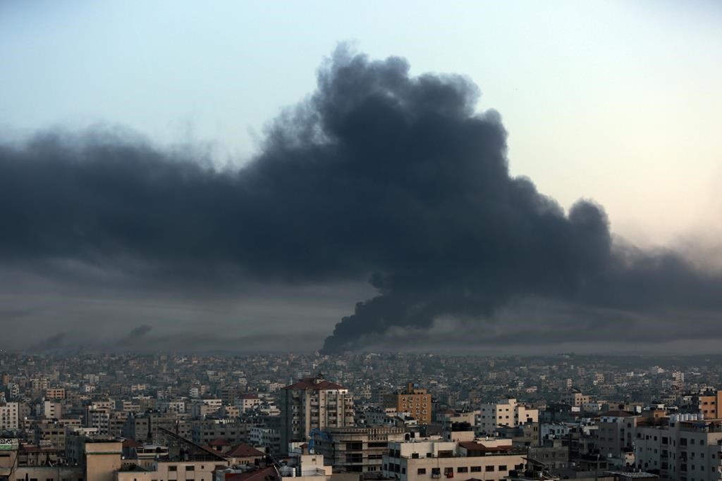 Black smoke raise from Eastern Gaza City, Thursday, Oct. 26, 2023 following Israeli airstrikes