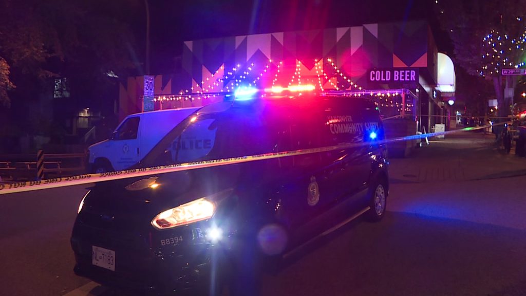 Vancouver police at the scene of a shooting in the Dunbar neighbourhood in October 2020. A man carrying a car seat with a baby in it was shot at and hit twice, while his wife and children were uninjured.