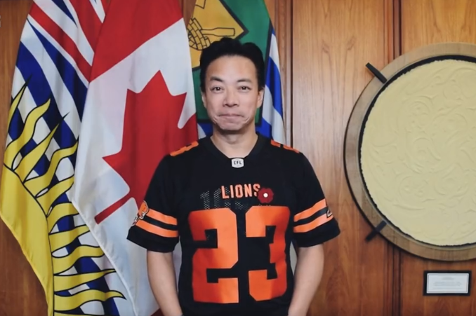 Vancouver Mayor Ken Sim wearing a BC Lions Jersey.