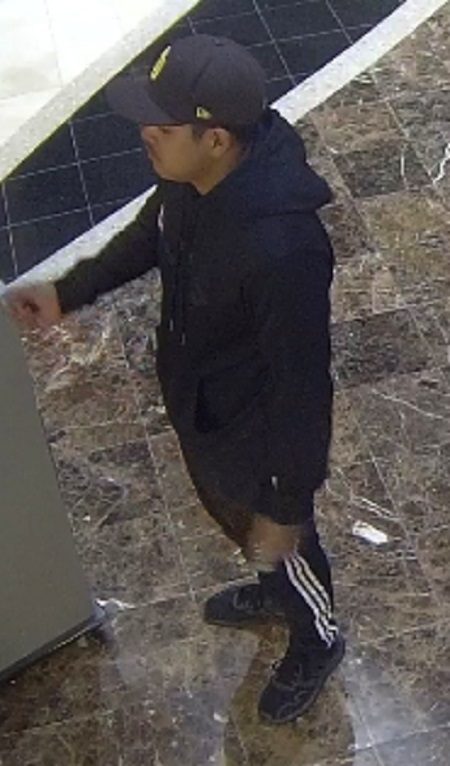 Burnaby RCMP has released photos of a suspect in relation to an alleged robbery in September. (Burnaby RCMP)