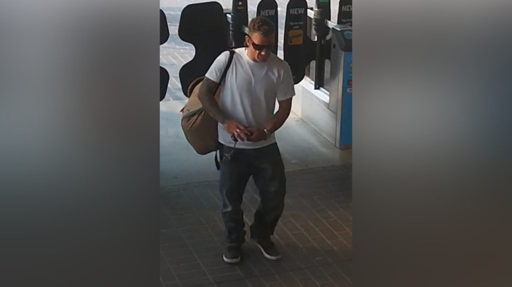 Vancouver police are looking for a suspect, pictured here, after a woman was reportedly assaulted in a SkyTrain station and a man pointed a gun at a group of people who tried to intervene. The suspect was wearing a white t-shirt, dark pants, dark, blocky sunglasses, and was carrying a bag at the time of the incident.