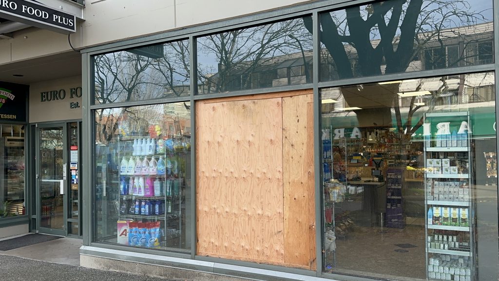 A wooden panel on a window.