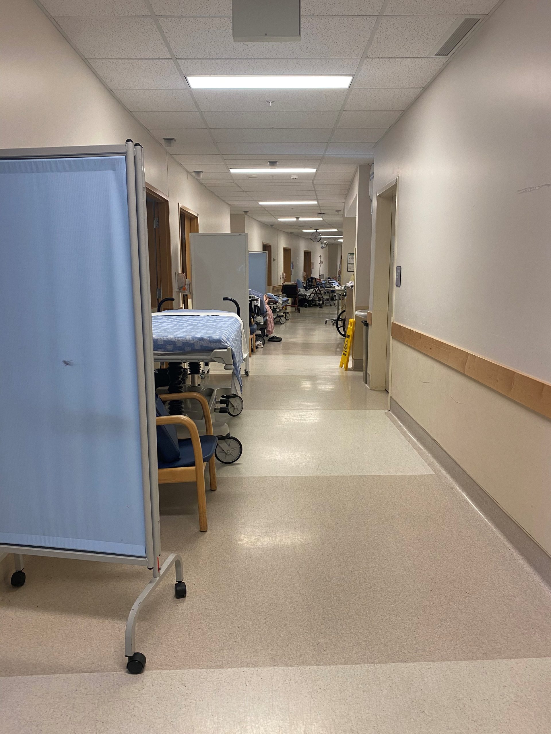 Stretchers lined up and down a hallway at Abbotsford Regional Hospital.