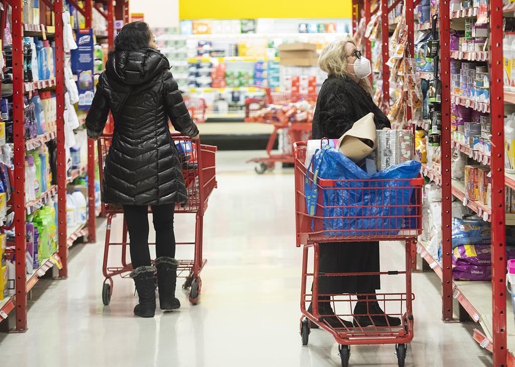 People shop in a grocery store in Montreal, Wednesday, Nov. 16, 2022. THE CANADIAN PRESS/Graham Hughes