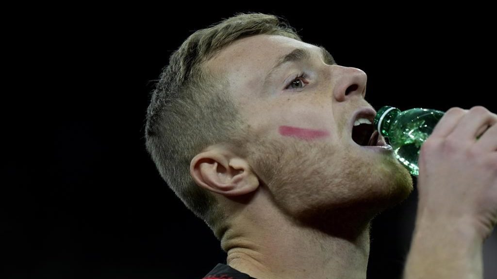 Male soccer players in Italy put red marks on faces in campaign to eliminate violence against women