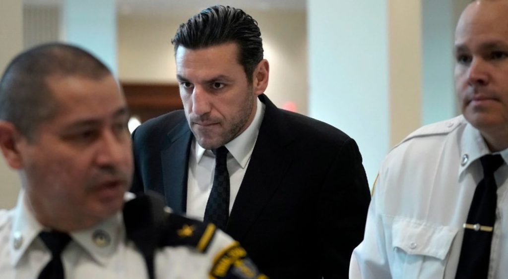 Boston Bruins forward Milan Lucic, centre, is flanked by court officers as he arrives at Boston Municipal Court in Boston, Tuesday, Nov. 21, 2023. (Steven Senne/AP)