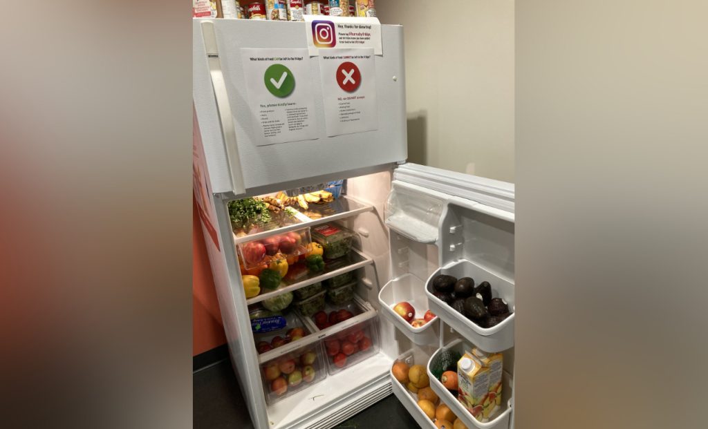 The food bank fridge at Simon Fraser University (SFU) on Burnaby Mountain stocked with vegetables, fruits, and other foods.