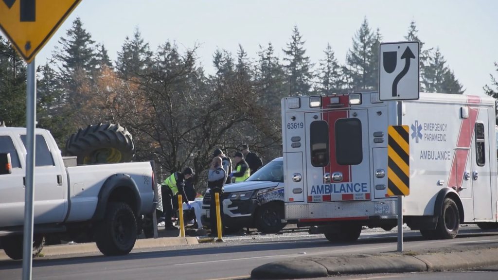 A tractor travelling on Highway 1 hit a police cruiser on Nov. 25, 2023, causing the tractor to roll over, according to Surrey RCMP