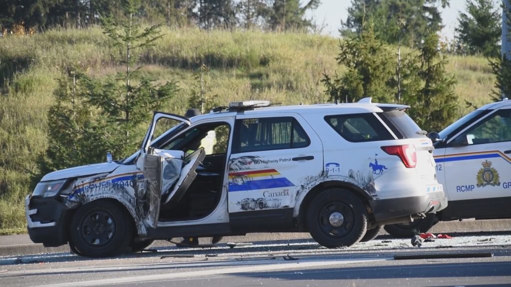 A tractor travelling on Highway 1 hit a police cruiser on Nov. 25, 2023, causing the tractor to roll over, according to Surrey RCMP