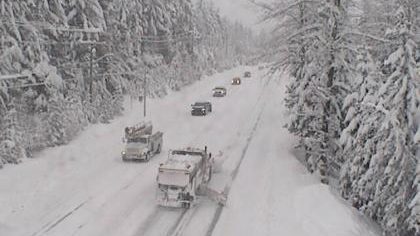 File image of Highway 99 near Whistler covered in snow. Trucks and cars driving through the snow.