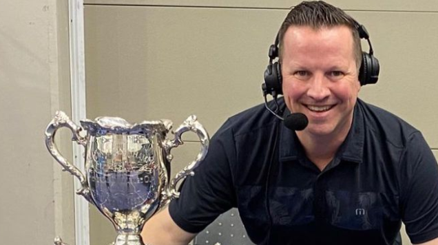 Longtime sportscaster Joey Kenward poses for a photo while wearing his broadcasting headset