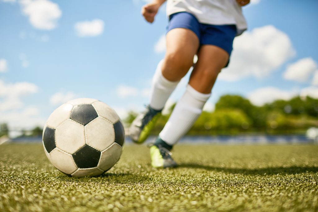 A child plays soccer