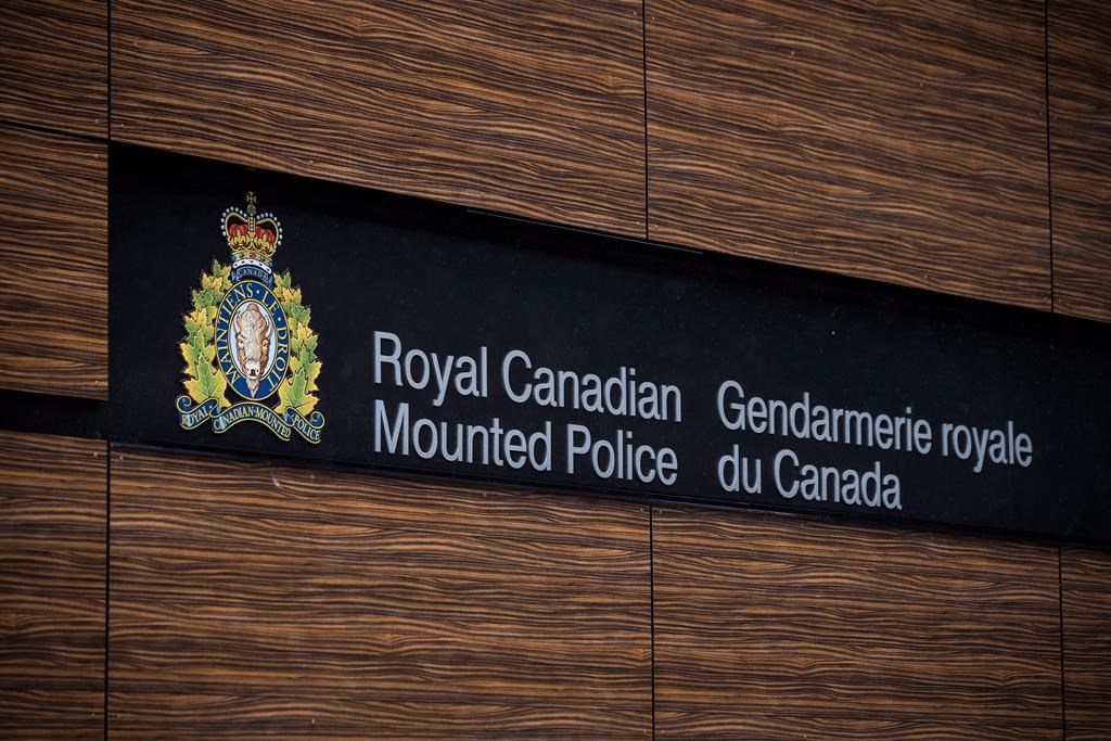 The RCMP logo is seen outside Royal Canadian Mounted Police "E" Division Headquarters, in Surrey, B.C., on Friday April 13, 2018. RCMP say an Ottawa youth has been arrested and charged with terrorism-related offences that allegedly targeted Jewish people.