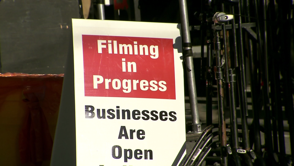 A 'Filming in Progress' sign at a Metro Vancouver movie set