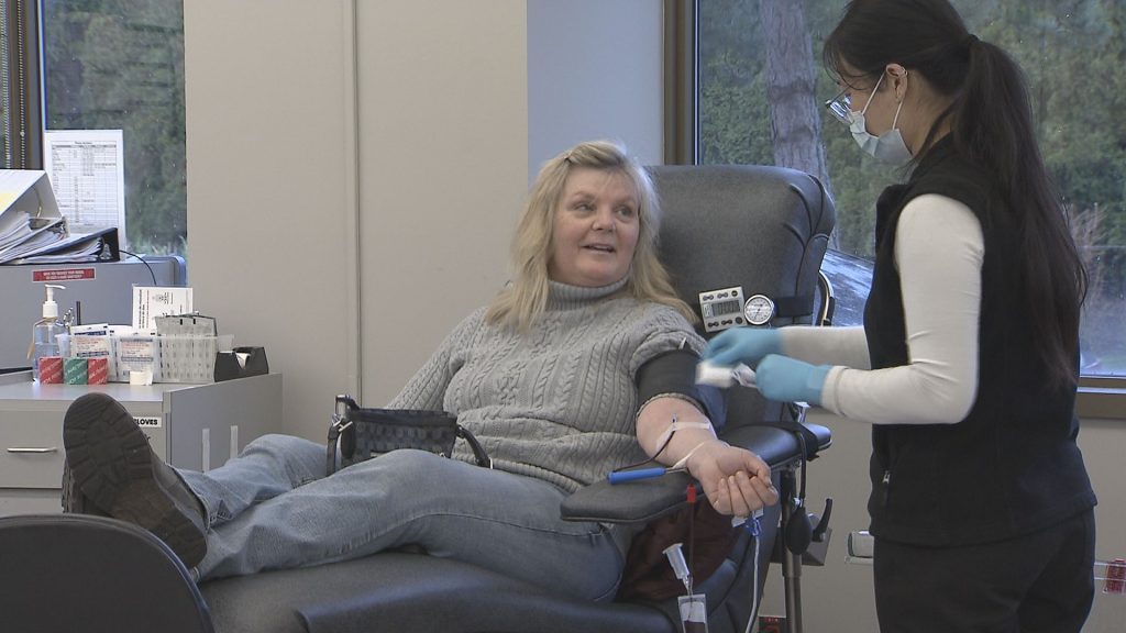 A person donates blood.