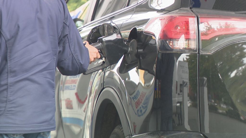 A driver pumps gas into their vehicle at a Metro Vancouver station