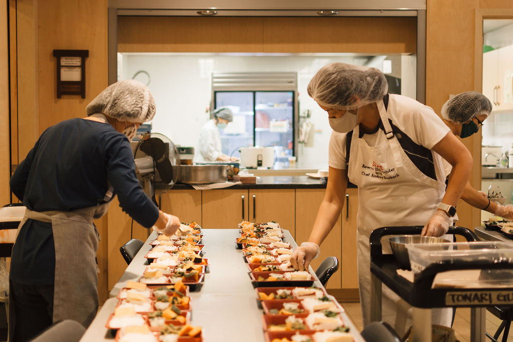 Tonari Gumi members make bento boxes to deliver to seniors living at home