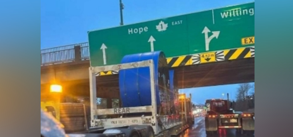 Photos of a possible new overpass strike appear to show a truck stuck on Highway 1 eastbound, underneath an overpass that indicates it is before the Willingdon exit.