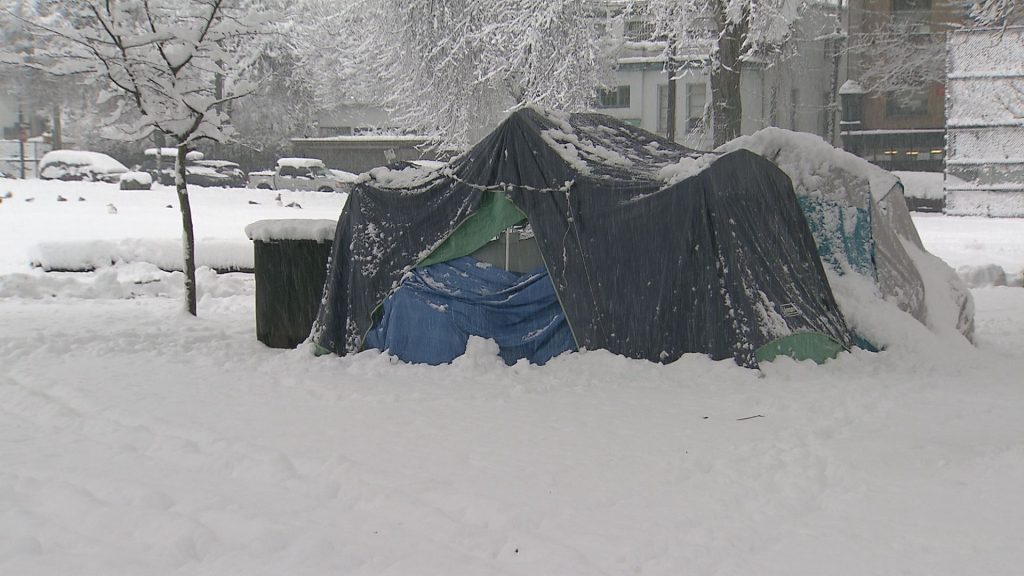 Tents are seen in Oppenheimer Park during heavy snowfall in Vancouver