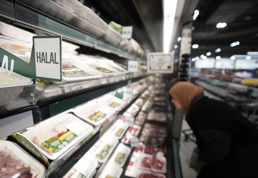 A women shops in the halal food section inside a Metro grocery store in Milton, Ont., on Friday, January 12, 2024.